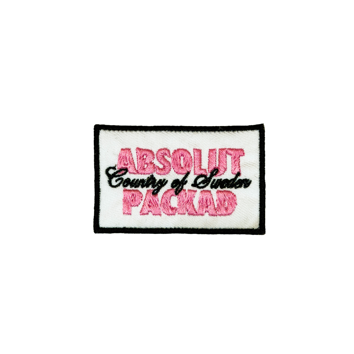 Absolut Packad rosa tygmärke